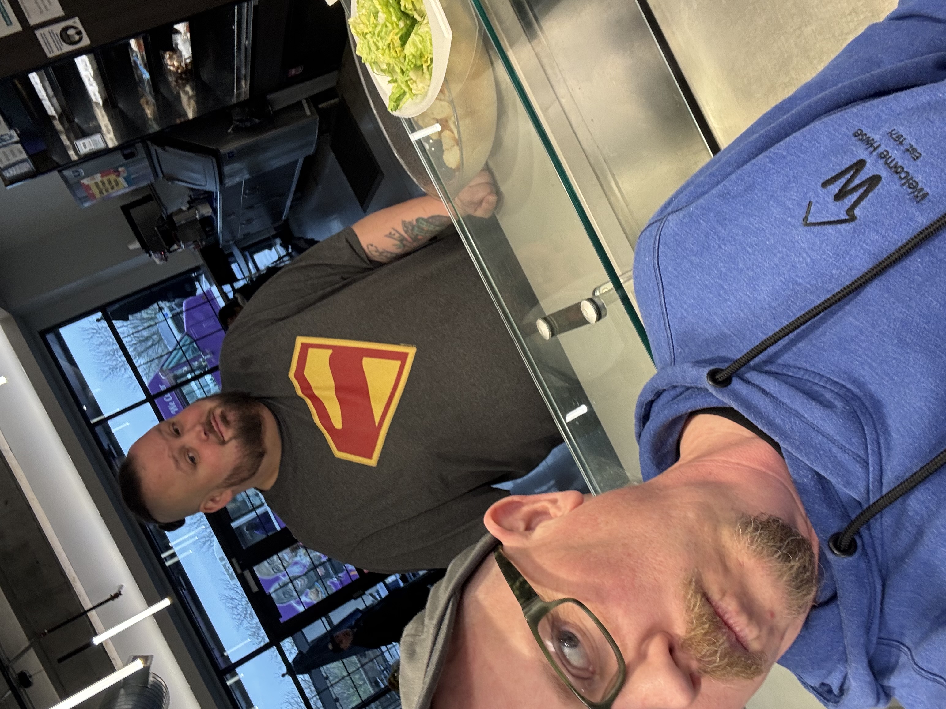 Two members of The Grove KC community together indoors.